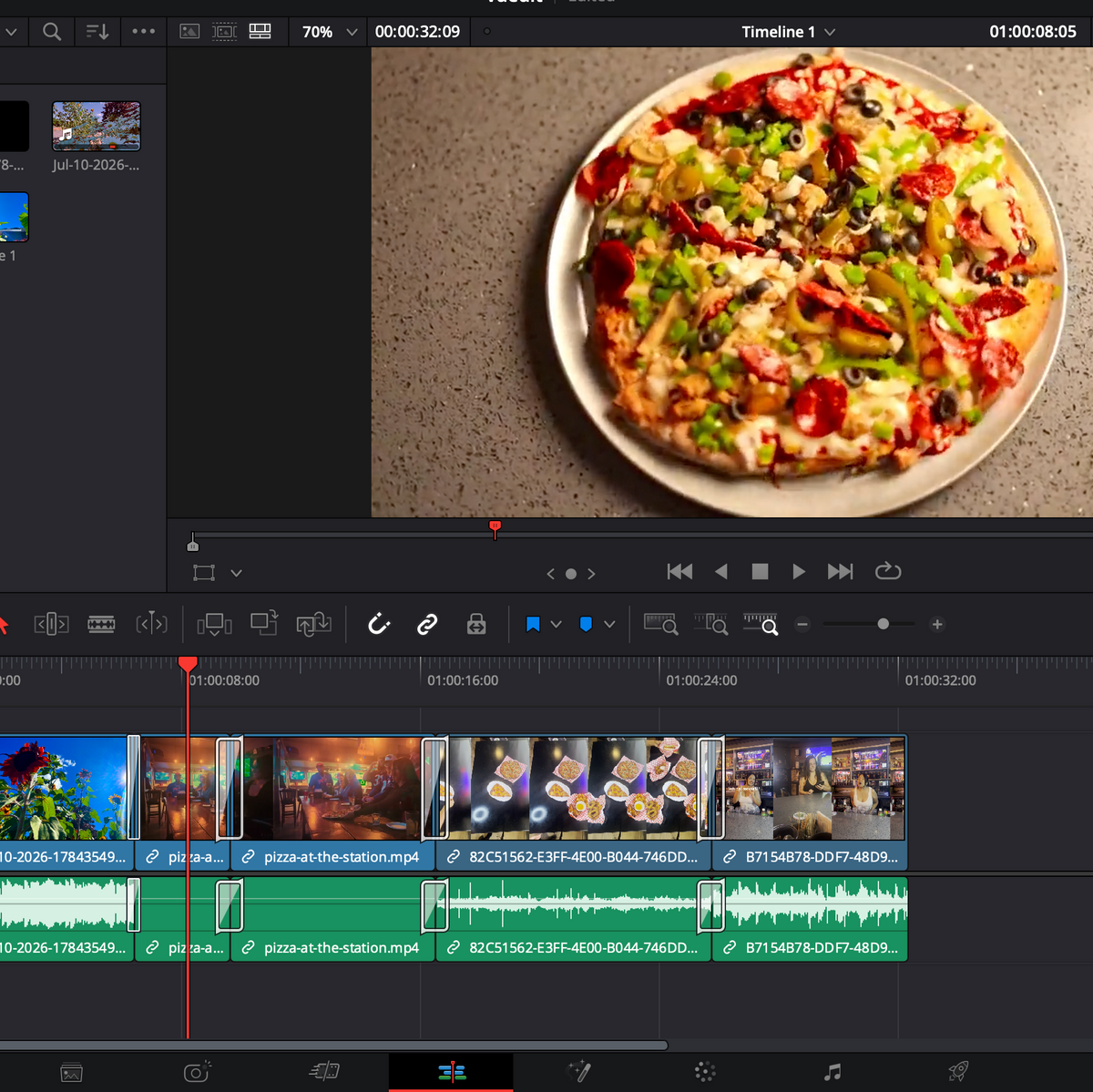 A screenshot of a video editing software timeline interface showing a photo of a pizza on a plate, with multiple video clips and audio tracks arranged in the timeline.
